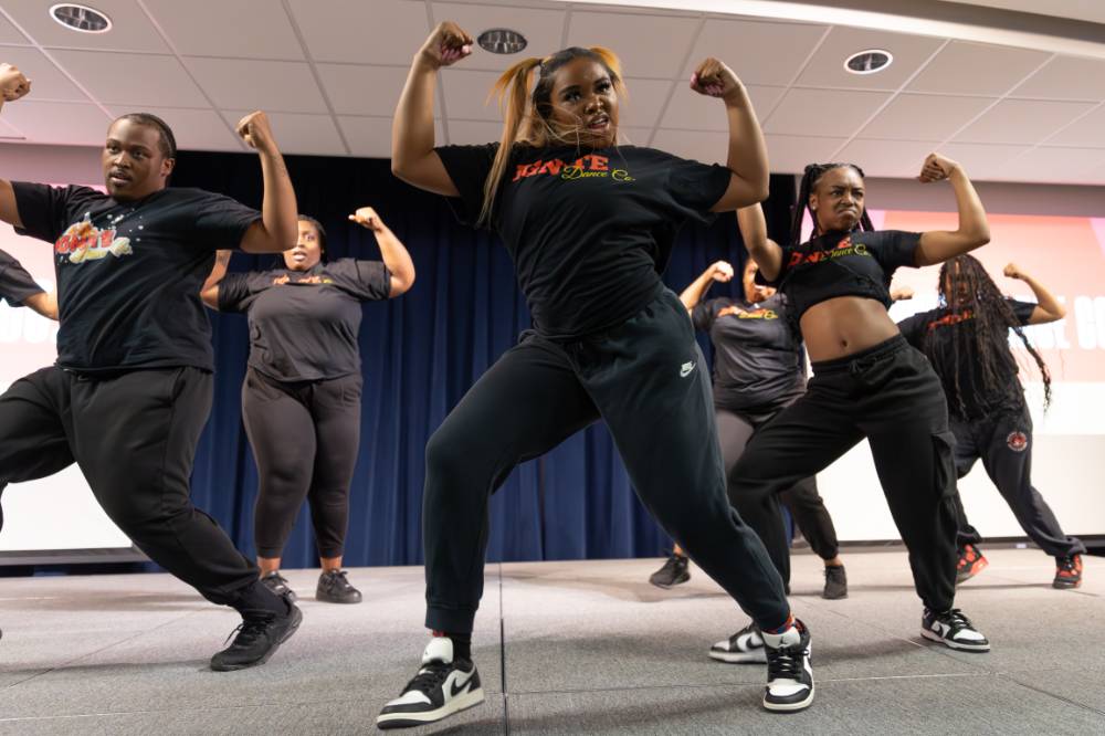 Dancers from Ignite Dance Co. striking a pose during their routine.